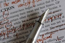 Red pen and edited manuscript
