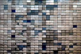 Rectangular tiles in various shades of gray and blue, with no discernible pattern