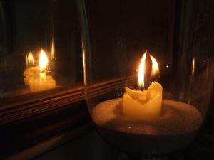 Candle reflected in a mirror