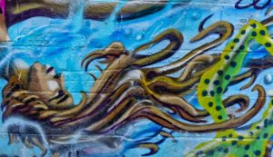 Graffiti of a mermaid with hair like tentacles